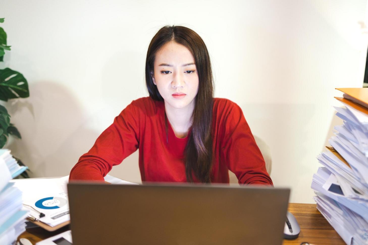 E-commerce professionals collaborating on SEO strategy with digital tools and documentation