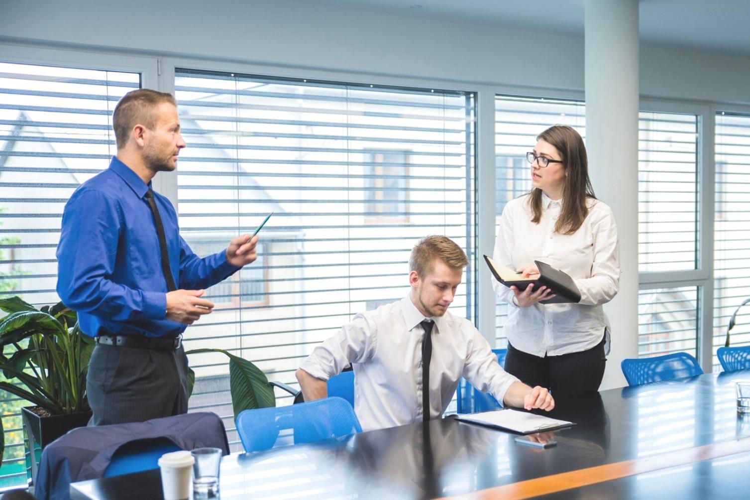 Team reviewing e-commerce SEO analytics and performance metrics on laptop screen